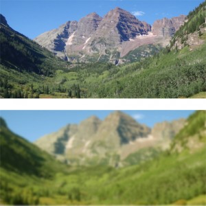 This images shows two different views of the same scene.  The top image is a clear view of a lovely mountain range in Colorado.  The bottom view is a slightly yellowed, unevenly-blurred view of the same mountains.  This is meant to simulate the visually-damaging effects of cataracts.